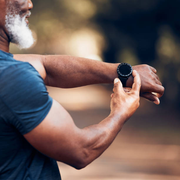 Smart watch, black man and exercise for fitness with mockup screen to check time performance. Hands of sports person with smartwatch health app for heart, steps and clock or workout progress outdoor